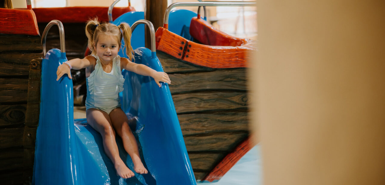 Child sliding down a waterslide